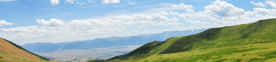 Fototapeta premium Beautiful panoramic landscape of mountains and alpine meadows, banner format