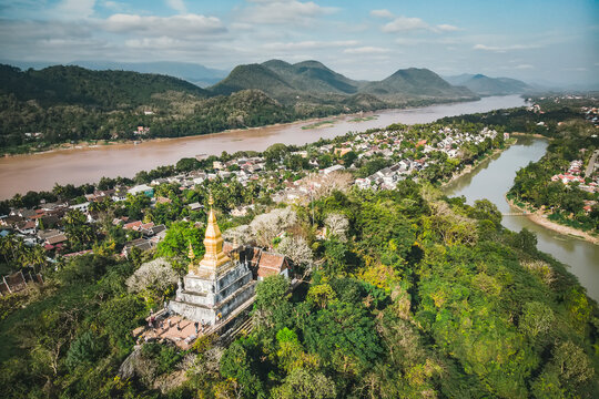Luang Prang Laos View. Mount Phousi. South East Asia, View town and surrounding countryside. golden pagoda of Wat Chom Si on the top of Mount Phou Si,