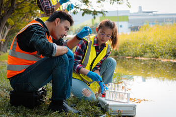 Scientists team collect water samples for analysis and research on water quality, environment with...