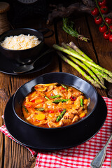 colorful turkey fricassee with asparagus and paprika
