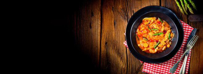 colorful turkey fricassee with asparagus and paprika