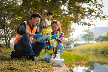 Scientists team collect water samples for analysis and research on water quality, environment with...