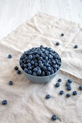 Raw Organic Blueberries in a Bowl, side view.