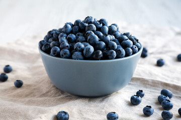 Raw Organic Blueberries in a Bowl, side view.
