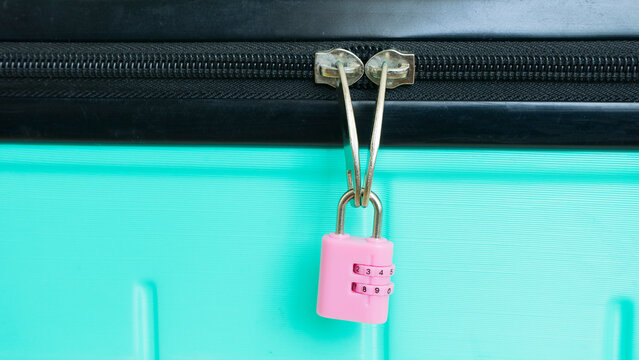 Pink combination lock on suitcase