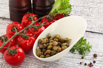 Marinated green capers in the bowl