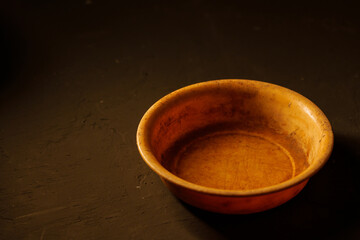 Empty bowl on dark background with copy space