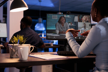 Businesswoman talking to colleagues on remote videoconference, using online telework videocall to chat about startup job. Discussing on internet teleconference meeting with webcam.