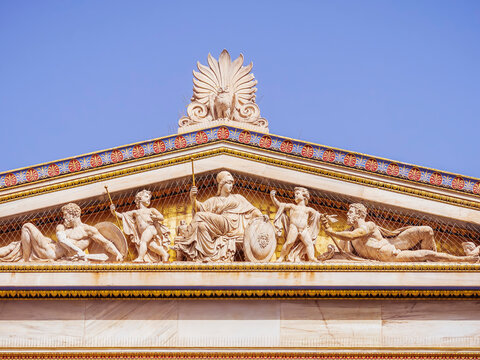 The east gable of the building of the National University of Athens, Greece. Athena, the goddess of wisdom and knowledge, sits on her throne with demigods and minor deities around her and an owl.