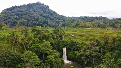 Beautiful aerial view - Panorama of natural waterfall in tropical forest.