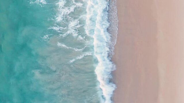 Phuket Thailand tropical beach Aerial drone top down view bird eye view of sea blue waves break on rock and sand. Beautiful of sea water wave come to beach.