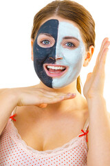 Girl with black white mud mask on face