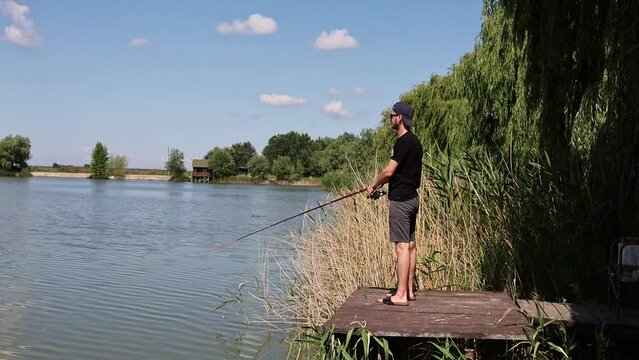 A man casting a fishing rod - slow motion