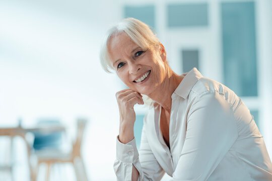 Smiling Senior Businesswoman In Office