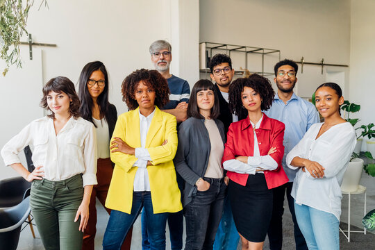 Smiling businessmen and businesswoman in office