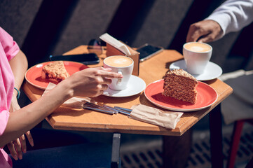 Obraz na płótnie Canvas Close up ogf a table with coffee and desert