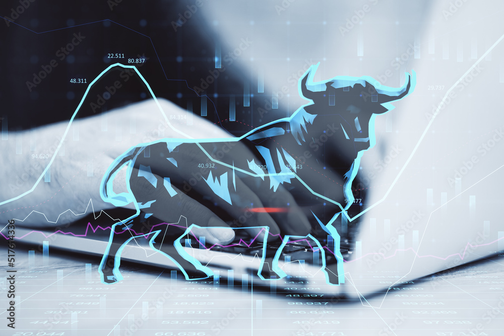 Aufkleber concept of bullish market. close up of businessman hands using laptop keyboard with glowing bull hol