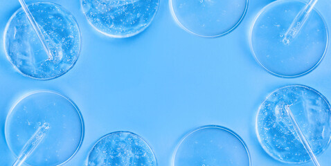 serum gel closeup in petri dish on a blue background	
