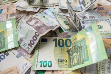 set of hryvnia dollar and euro banknotes as business background. Money saving concept