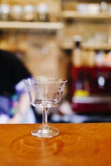 an empty glass is on the bar