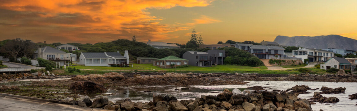 Beautiful panoramic sunset view of the shark city in Gansbaai (South Africa), this South African city is famous for the sighting of white sharks in its shark alley in the Atlantic Ocean.