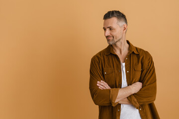 White grey man wearing shirt smiling and looking aside