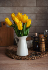 Beautiful tulip flowers  on table at kitchen