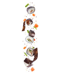 Sushi rolls and ingredients in the air isolated on a white background