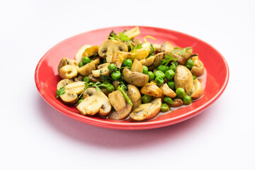 Mushroom and Pea Curry with Roasted Garlic, Indian food served in a bowl