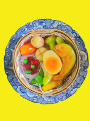 Thai Dessert, Ball plated dessert, Thai dessert made with mashed green beans. dessert plate on  isolated yellow background