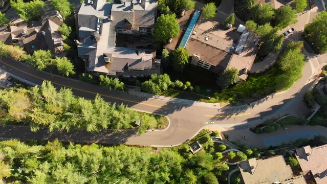 Aerial rotating shot of vail city houses and trees in the city.4k Aerial Drone Footage - Vail Colorado in Summer. Colorado Rocky Mountains
 