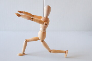 Wooden doll as a model for exercising in a healthy life	
