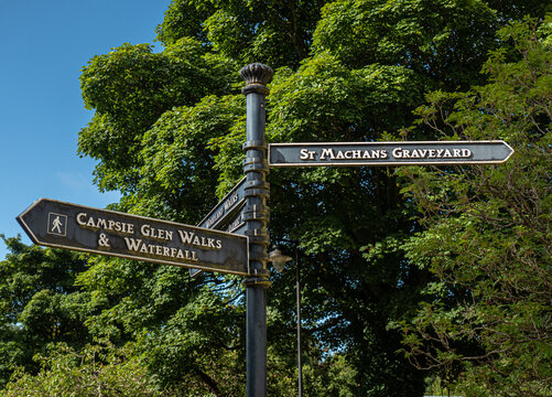 A signpost in Campsie Glen for walks to the waterfalls and St Machan Graveyard