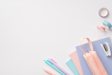 Back to school concept. Top view photo of diaries pens pink pencil-case mini stapler and adhesive...