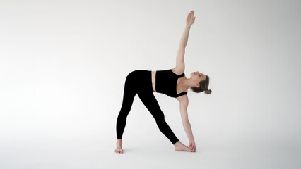 Naklejka premium Young woman practicing yoga isolated. Girl meditating and doing exercises. Training, workout, fitness, healthy lifestyle, self care, yoga, meditation, mindfulness concept