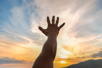 open human hand in the sunset