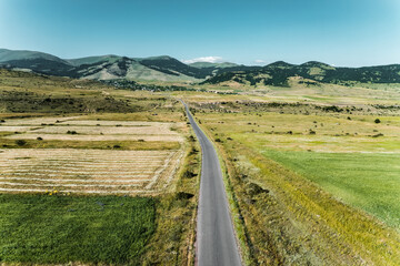 A beautiful tranquil scene of gorgeous landscape in Armenia, Buzhakan village with beautiful highlands, villages and roadway