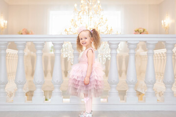 Fototapeta na wymiar Little cute girl in Beautiful dress is smiling