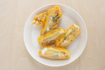 Japanese boiled shrimps and herbal Shiso in fried egg roll