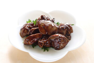 Chinese food, braised chicken livers on white dish for comfort food image