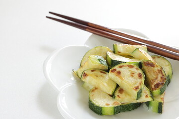 Chinese food, pan fried zucchini on white dish for vegetarian food image