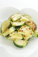 Chinese food, pan fried zucchini on white dish for vegetarian food image