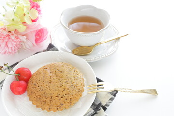 Homemade brown sugar cake and cherry served with English tea