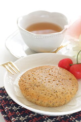 Homemade brown sugar cake and cherry served with English tea