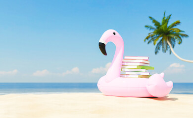 Stack of books placed on inflatable flamingo on sandy seashore © Antonio Solano