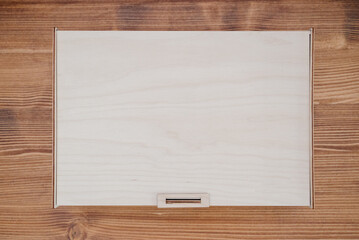 Wooden empty box on wooden background. Top view.