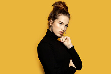 Portrait of fascinating girl feeling comfy in pretty pullover. Winter and fashion concept....