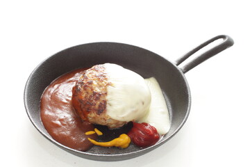 Homemade hamburger patty on skillet pan for comfort food image