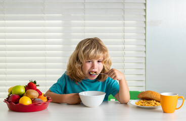 Child eats organic food. Healthy vegetables with vitamins. Proper kids nutrition concept.