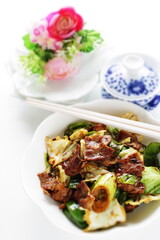 Chinese food, pork and cabbage stir fried green pepper and  black bean sauce with tea